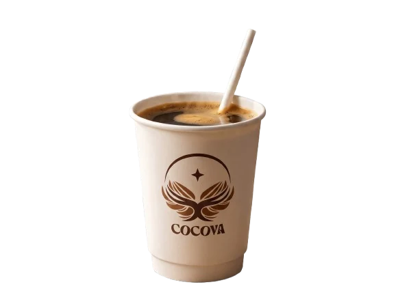 A Cocova signature cocoa in a kraft cup, served with a paper straw.