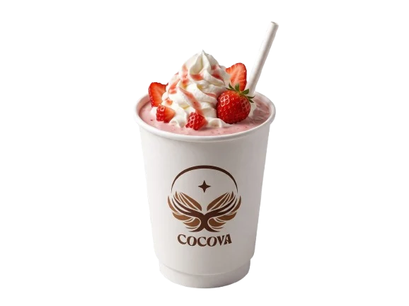 A Cocova strawberry milkshake in a kraft cup, topped with whipped cream and fresh strawberries.